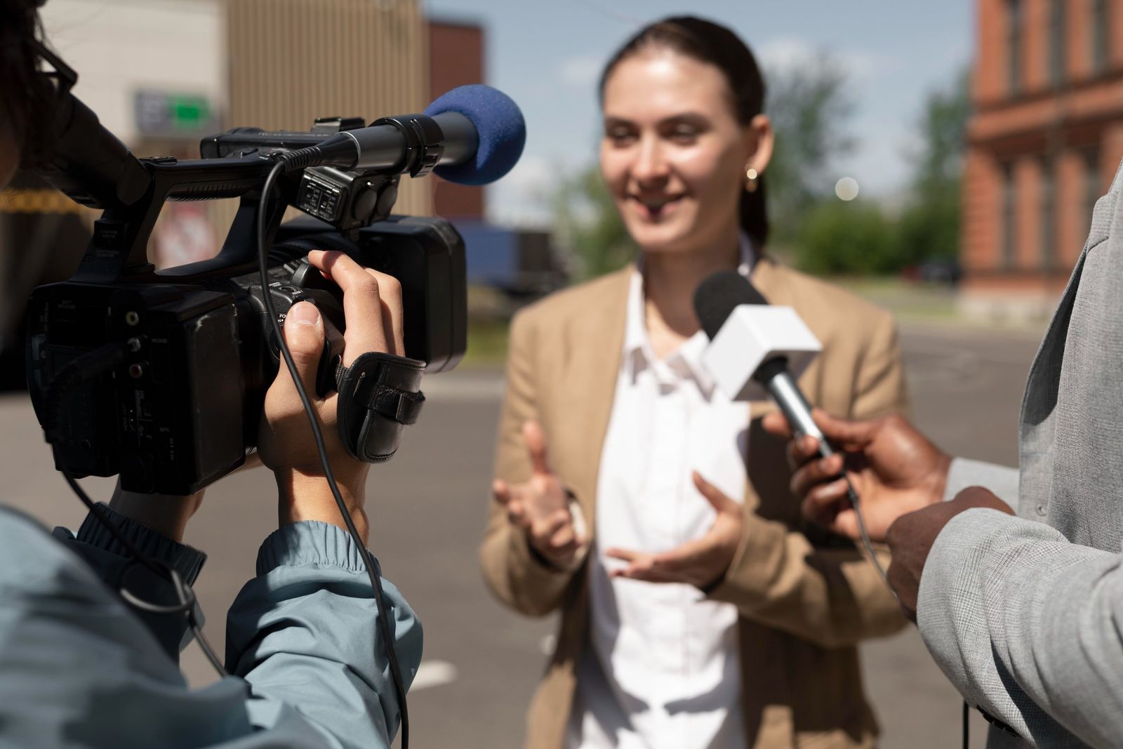 A journalist records a community event